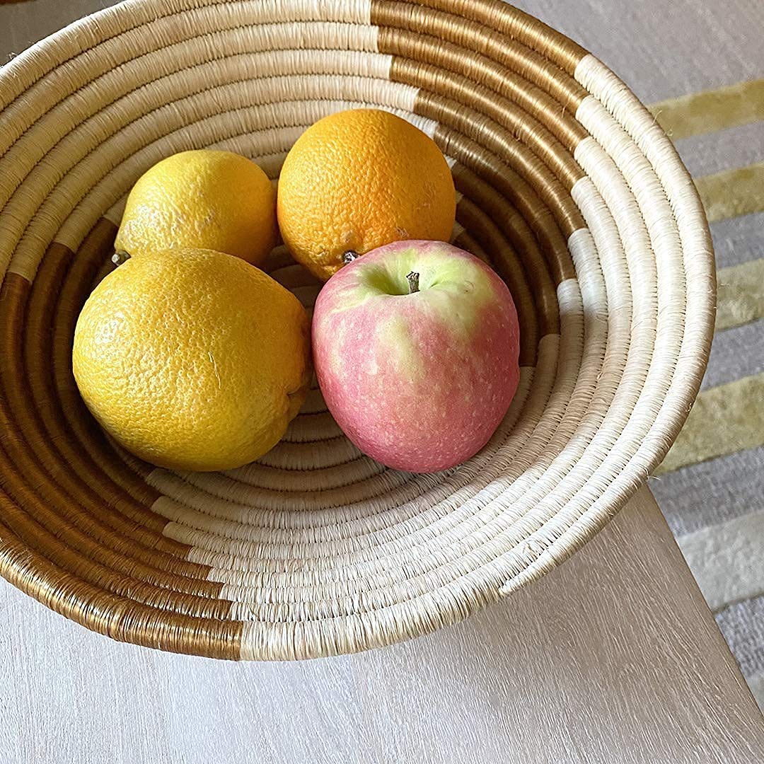 Indego African Handmade Sisal Woven Basket, showcasing intricate weaving patterns and natural fibers, perfect for home decor.