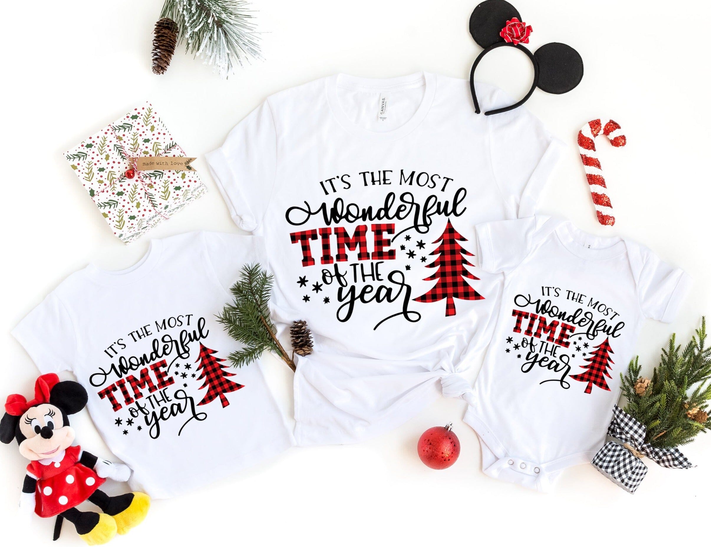 A cozy and cute holiday-themed onesie for babies, featuring a festive design that reads 'It's The Most Wonderful Time Of The Year'.