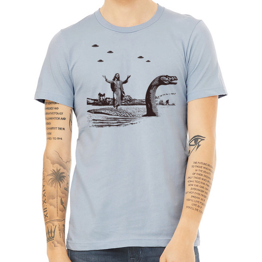 Men's T-shirt featuring Jesus Christ riding the Loch Ness Monster, hand printed with eco-friendly ink.