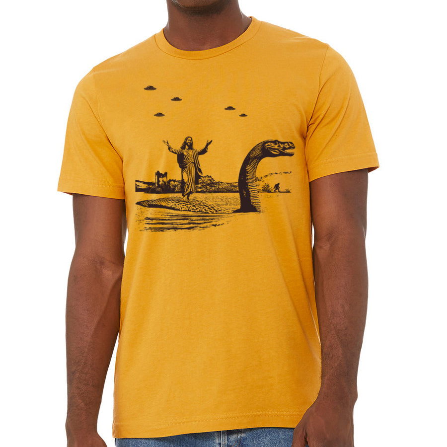 Men's T-shirt featuring Jesus Christ riding the Loch Ness Monster, hand printed with eco-friendly ink.