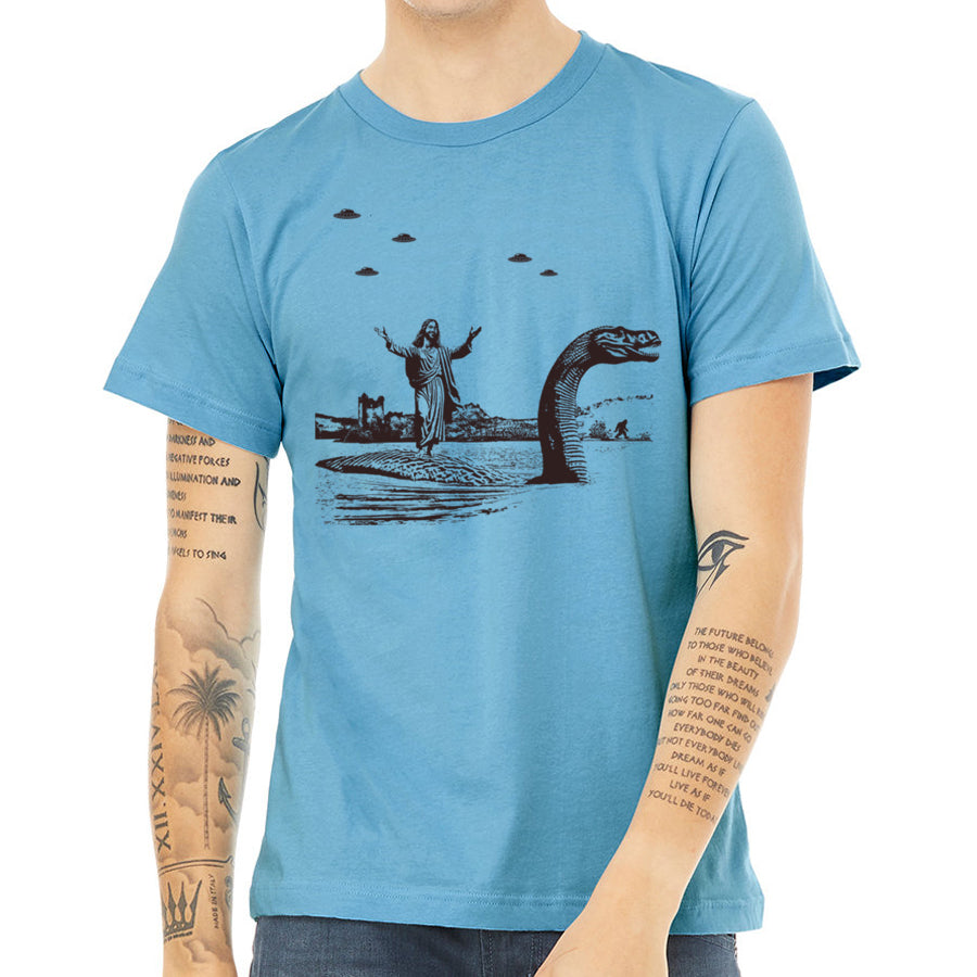 Men's T-shirt featuring Jesus Christ riding the Loch Ness Monster, hand printed with eco-friendly ink.