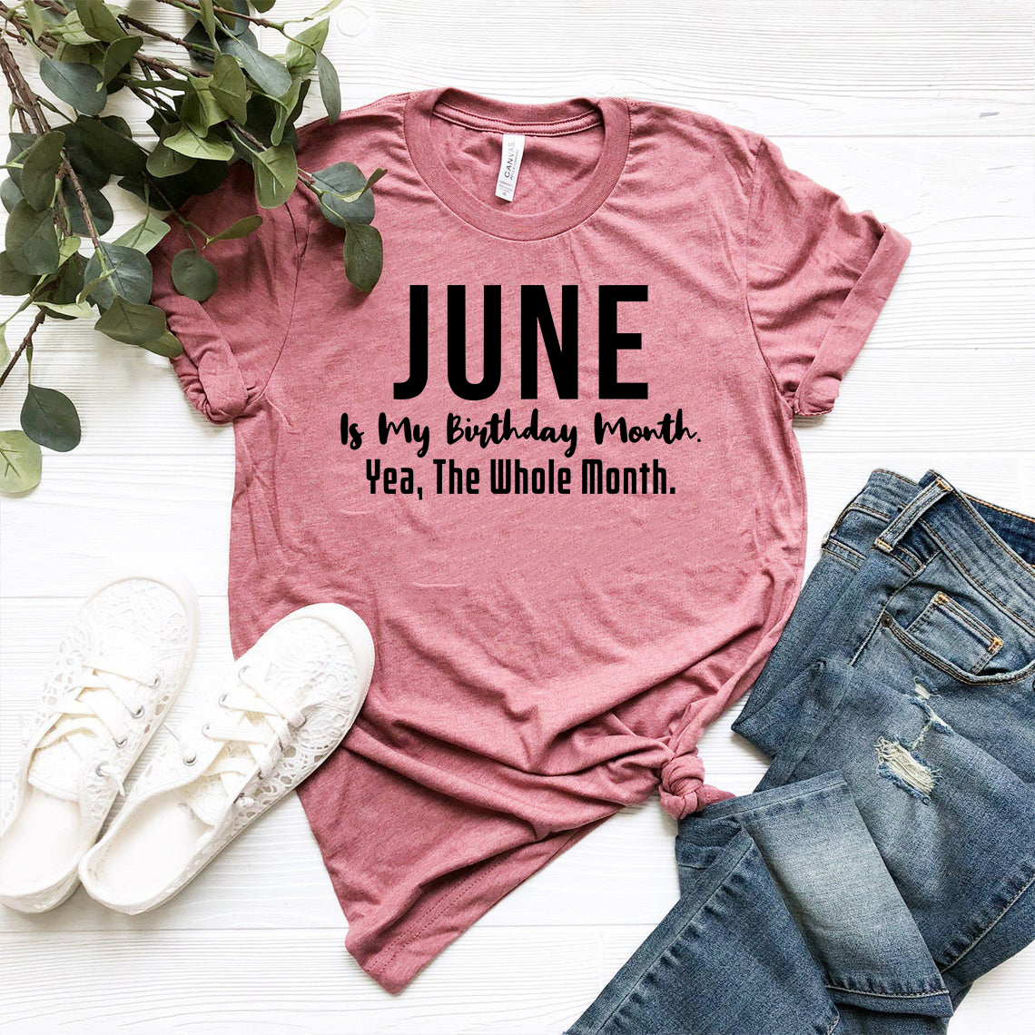 A unisex T-shirt featuring the phrase 'June Is My Birthday Month Yea The Whole Month' in vibrant colors, made from soft ring spun cotton.