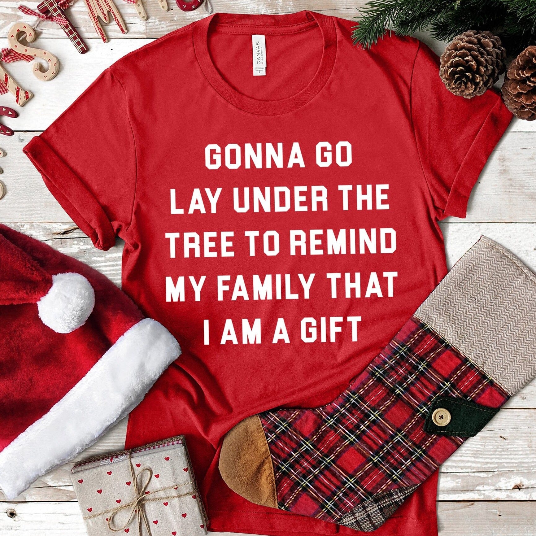 Lay Under A Tree Christmas Tee featuring a festive design, made from soft Ringspun Cotton, suitable for both men and women.