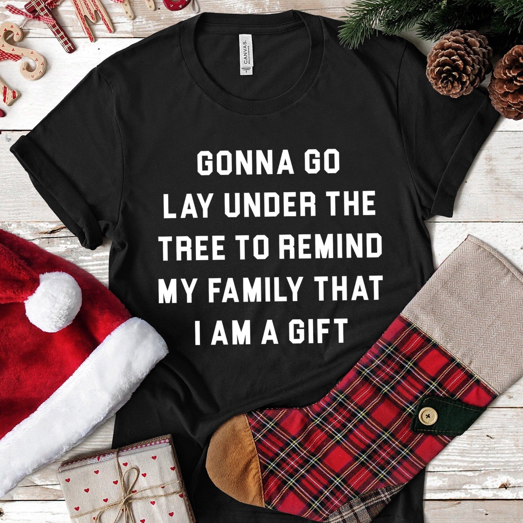Lay Under A Tree Christmas Tee featuring a festive design, made from soft Ringspun Cotton, suitable for both men and women.