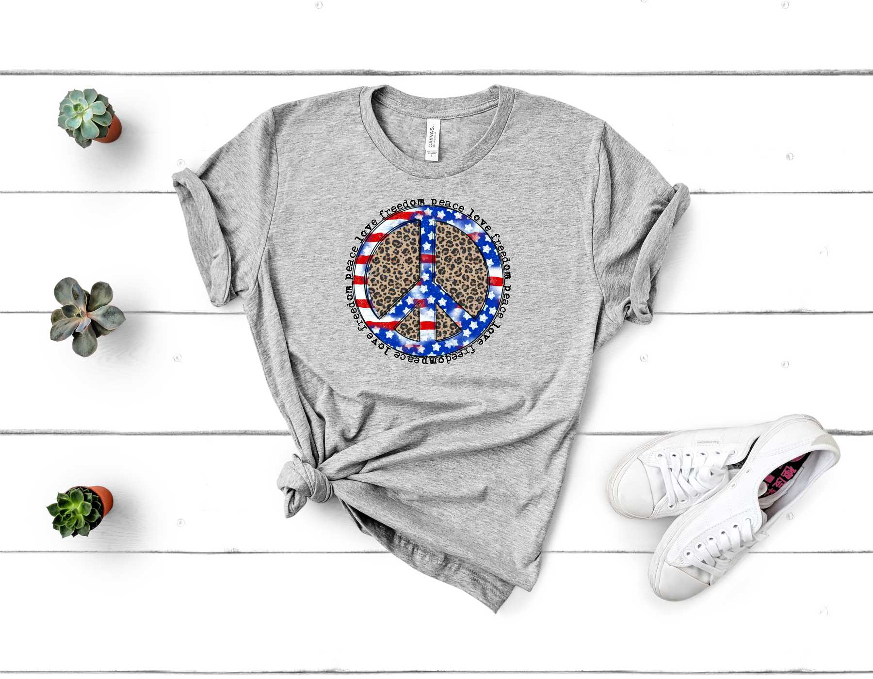 A stylish unisex graphic tee featuring a leopard print peace sign, symbolizing patriotism and peace.