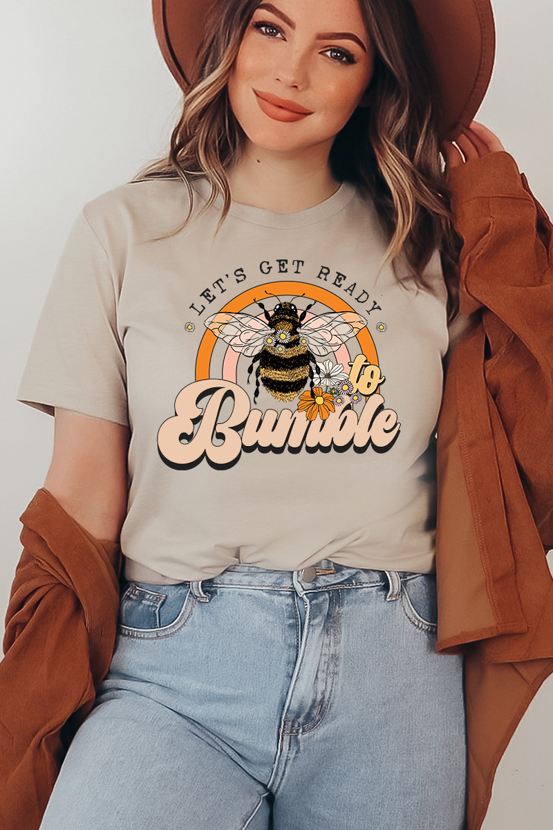 A stylish 'Let's Get Ready To Bumble' T-shirt made from premium ring spun cotton, featuring a vibrant flex print design.