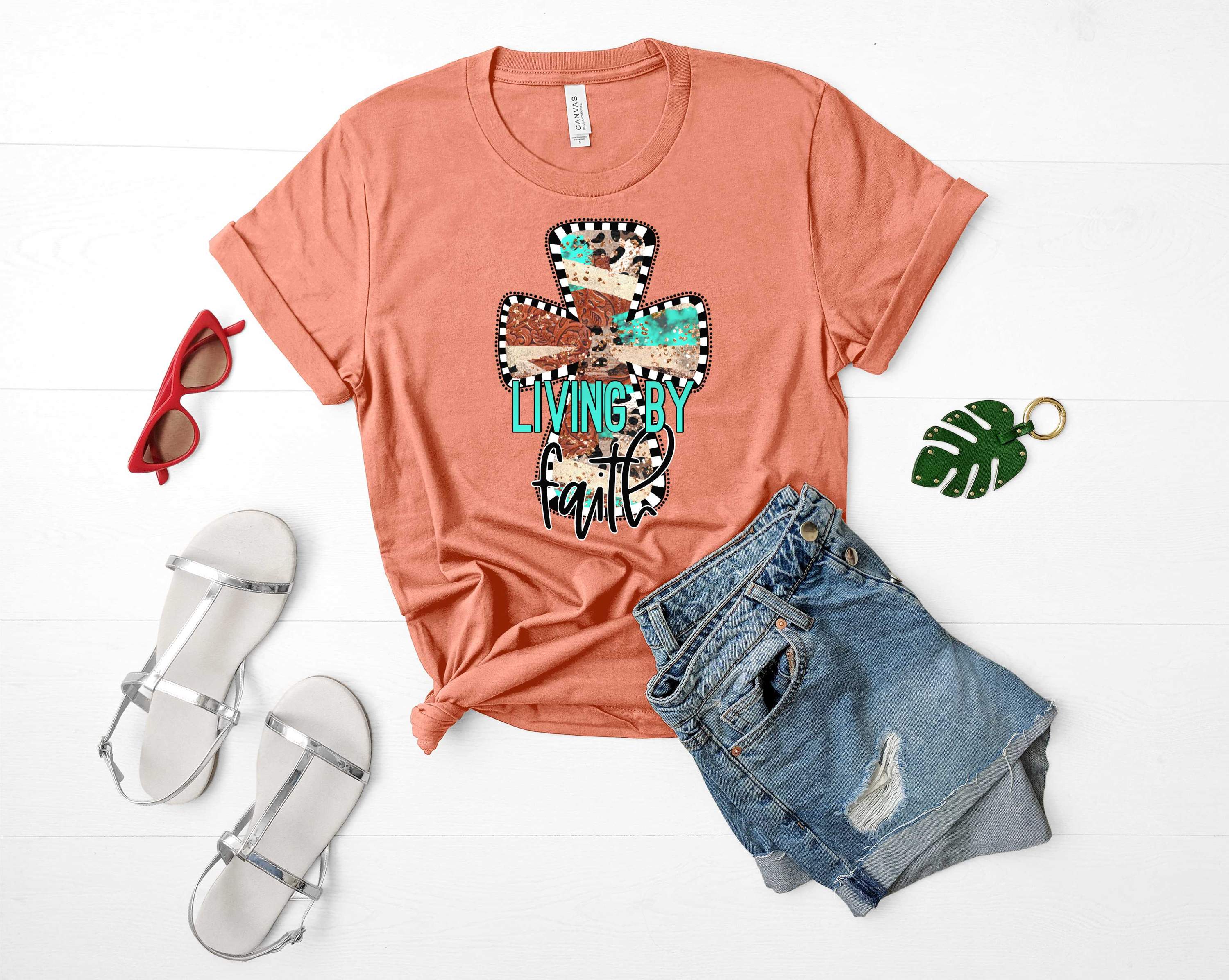 Living by Faith Cross Graphic Tee featuring a bold cross design on a soft unisex t-shirt.