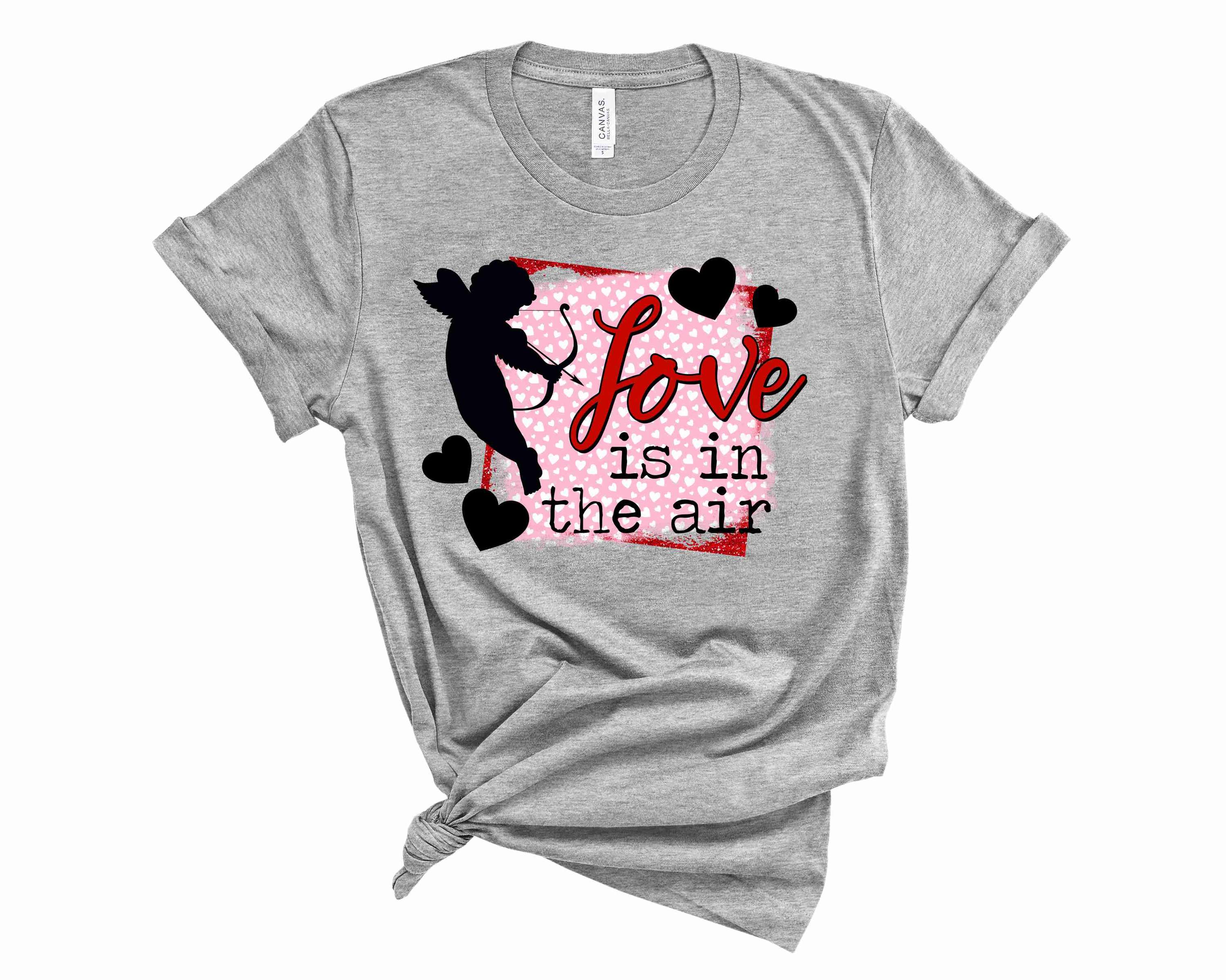 A unisex graphic tee featuring a Cupid design, symbolizing love and affection, perfect for casual wear.