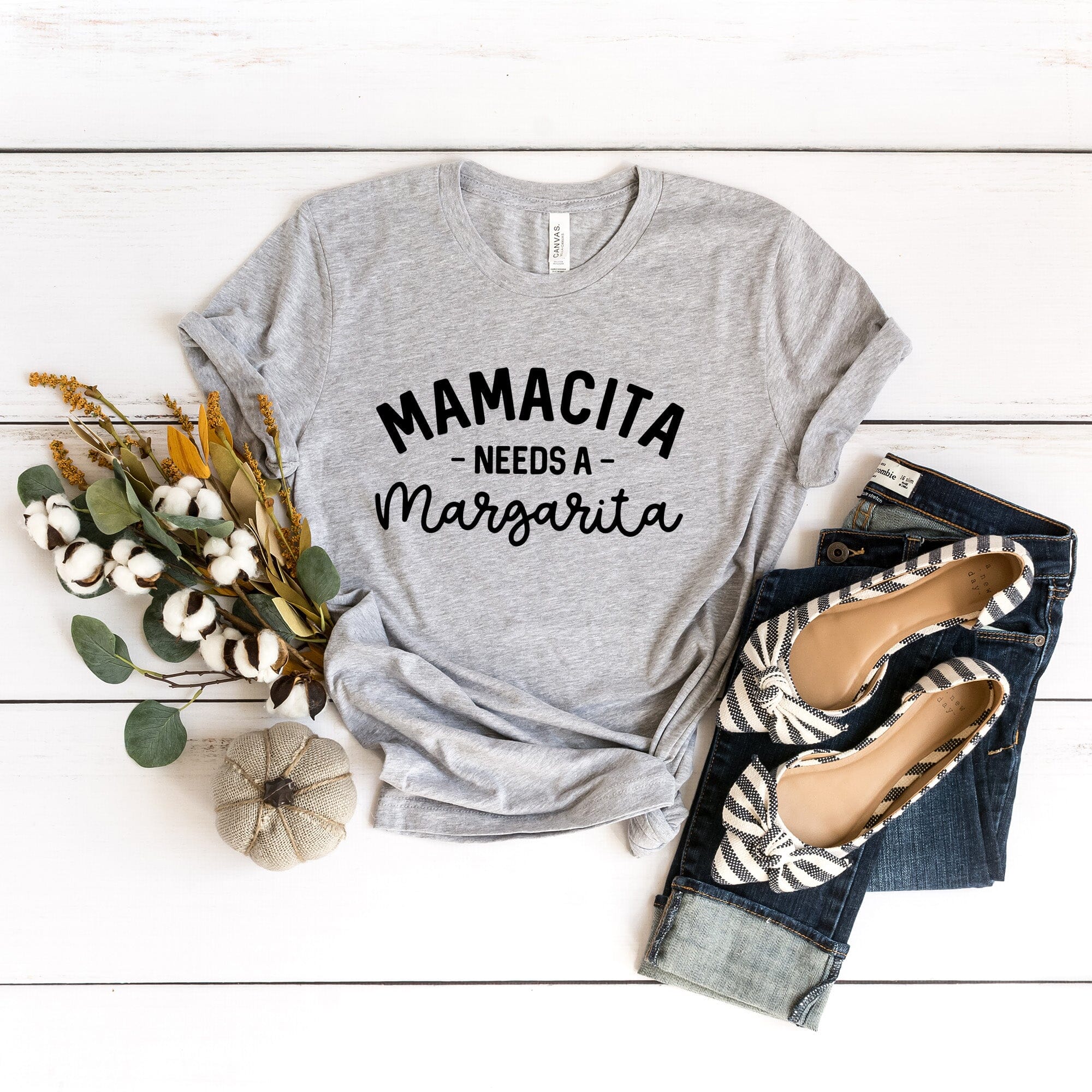 Mamacita Needs a Margarita Tee displayed on a hanger, showcasing its vibrant color and comfortable fabric.