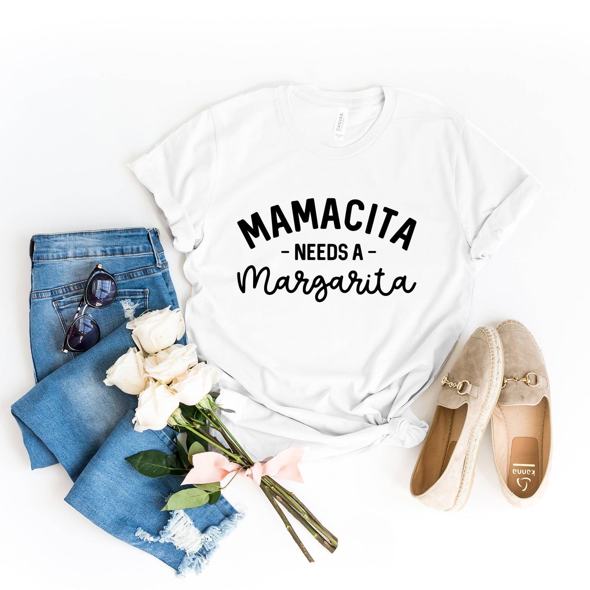 Mamacita Needs a Margarita Tee displayed on a hanger, showcasing its vibrant color and comfortable fabric.