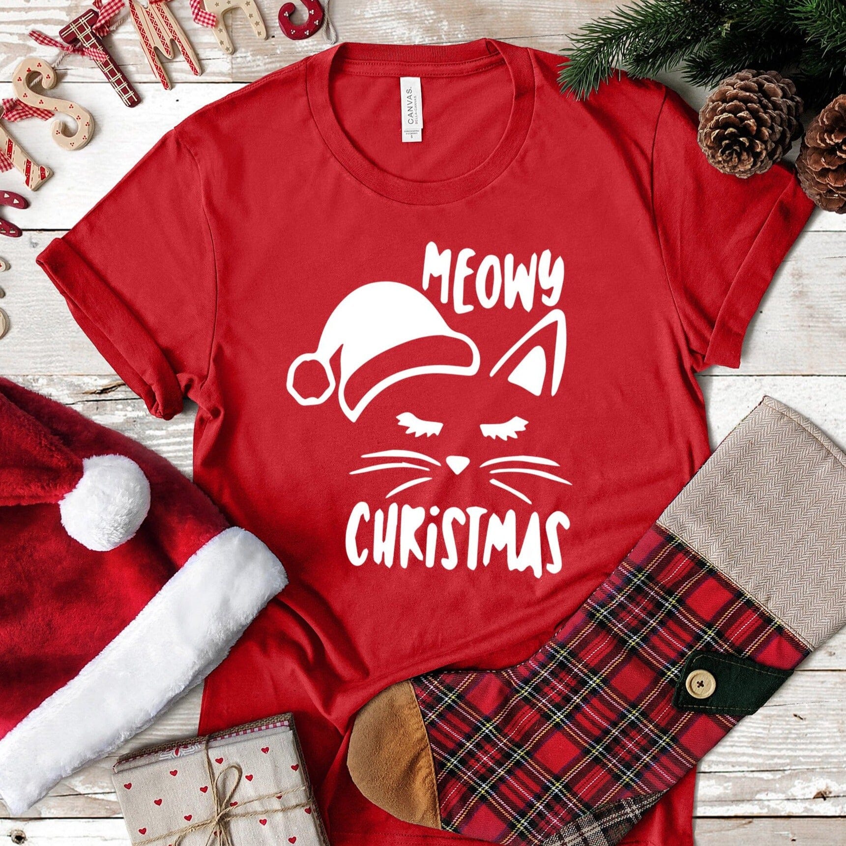 A festive Meowy Christmas Tee featuring a playful cat design, perfect for holiday celebrations.