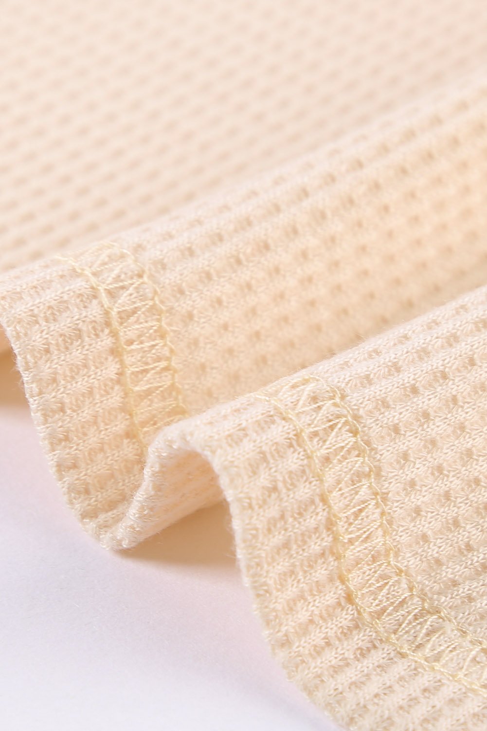 A stylish Mixed Leopard Ruffle Sleeve Waffle V Neck Knit Top featuring a v-neckline, ruffle sleeves, and a bold leopard print design.