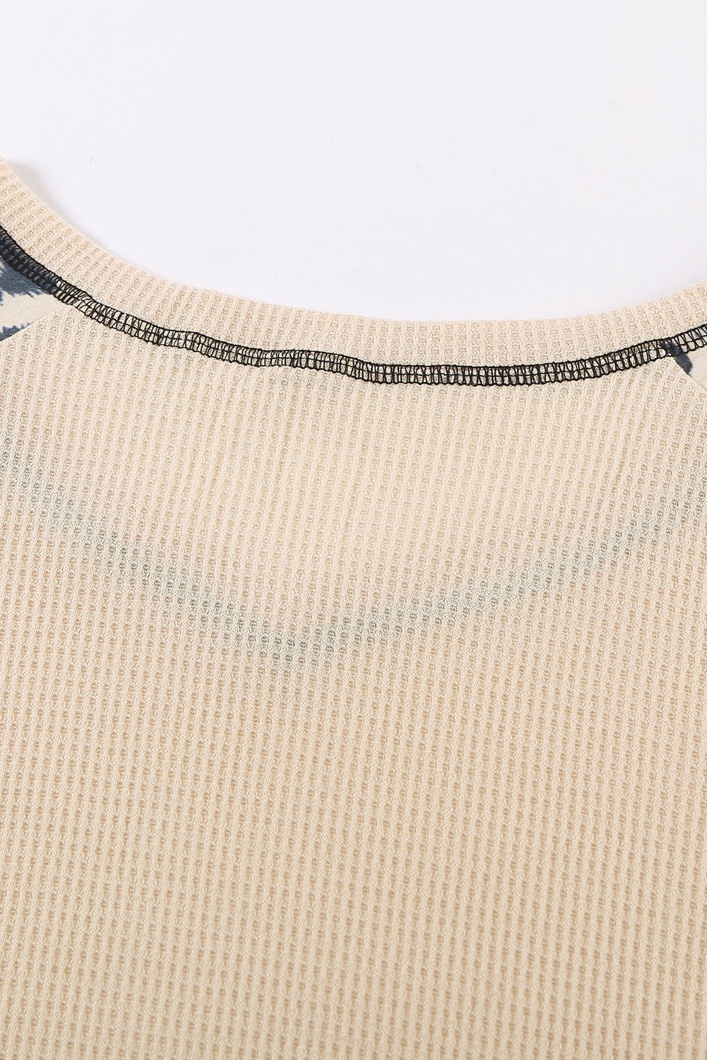 A stylish Mixed Leopard Ruffle Sleeve Waffle V Neck Knit Top featuring a v-neckline, ruffle sleeves, and a bold leopard print design.