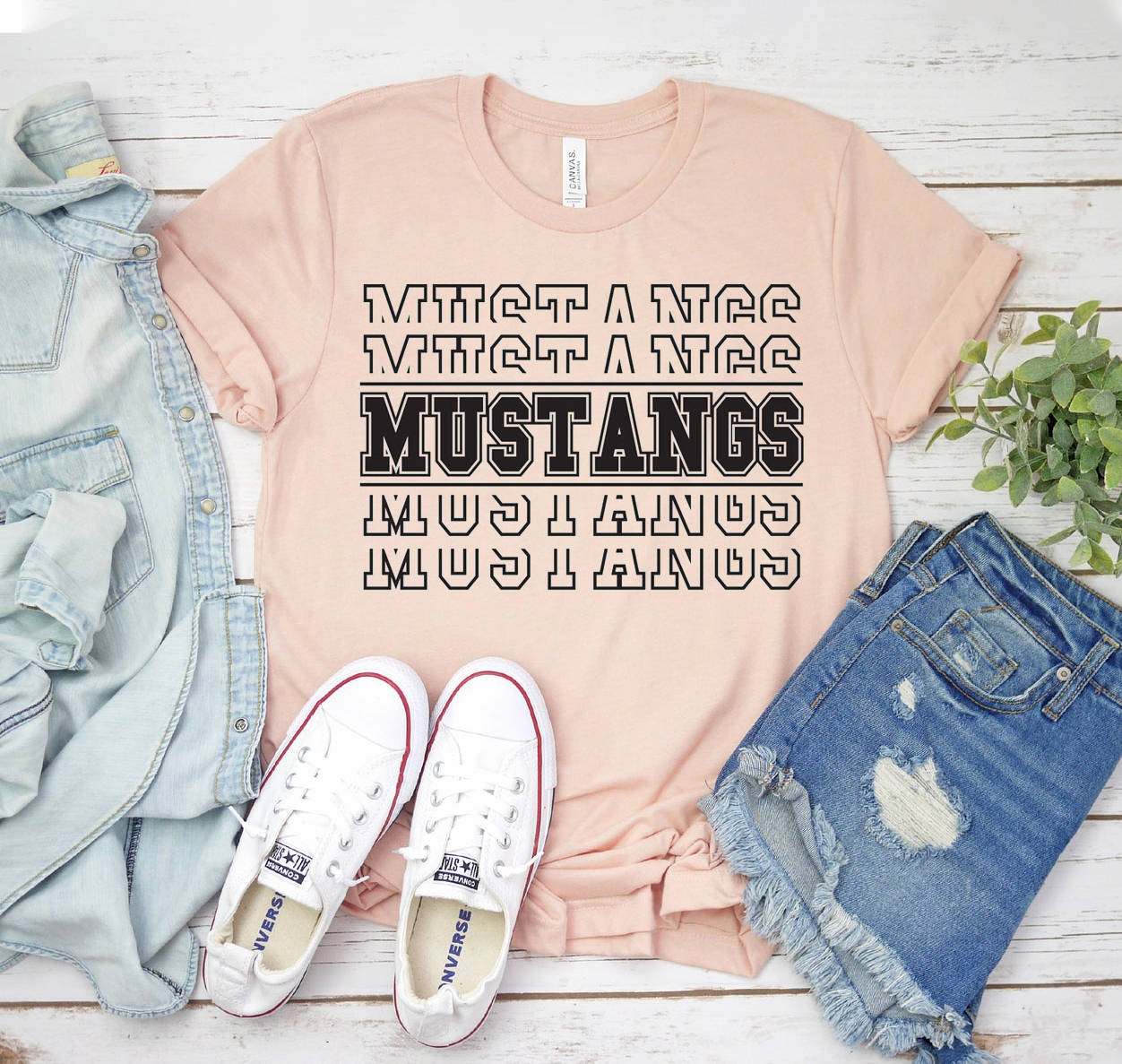 Mustangs Football T-shirt in various sizes, showcasing its classic unisex design and soft fabric.