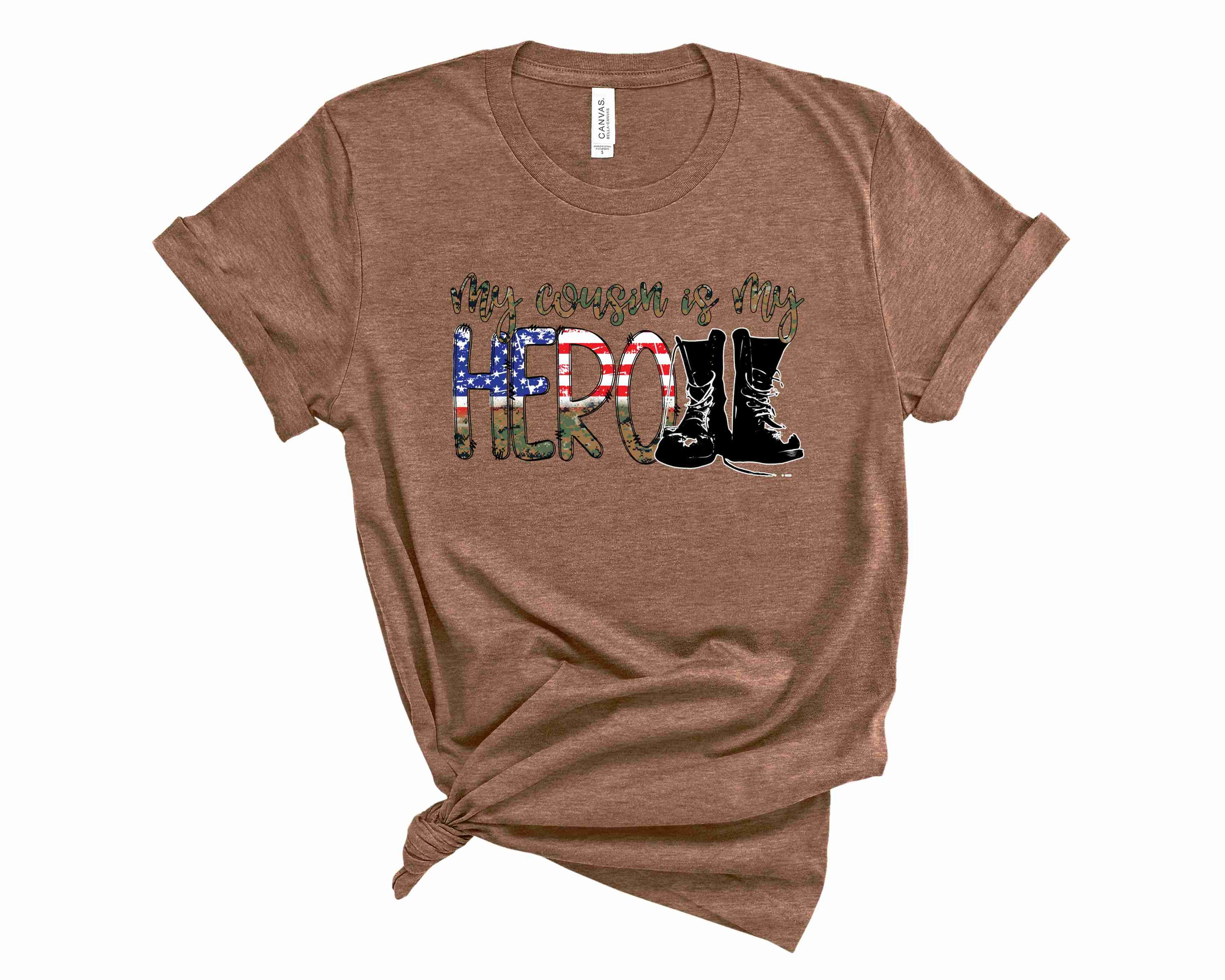 My Cousin Is My Hero Camo Graphic Tee featuring a stylish camouflage pattern and bold text.