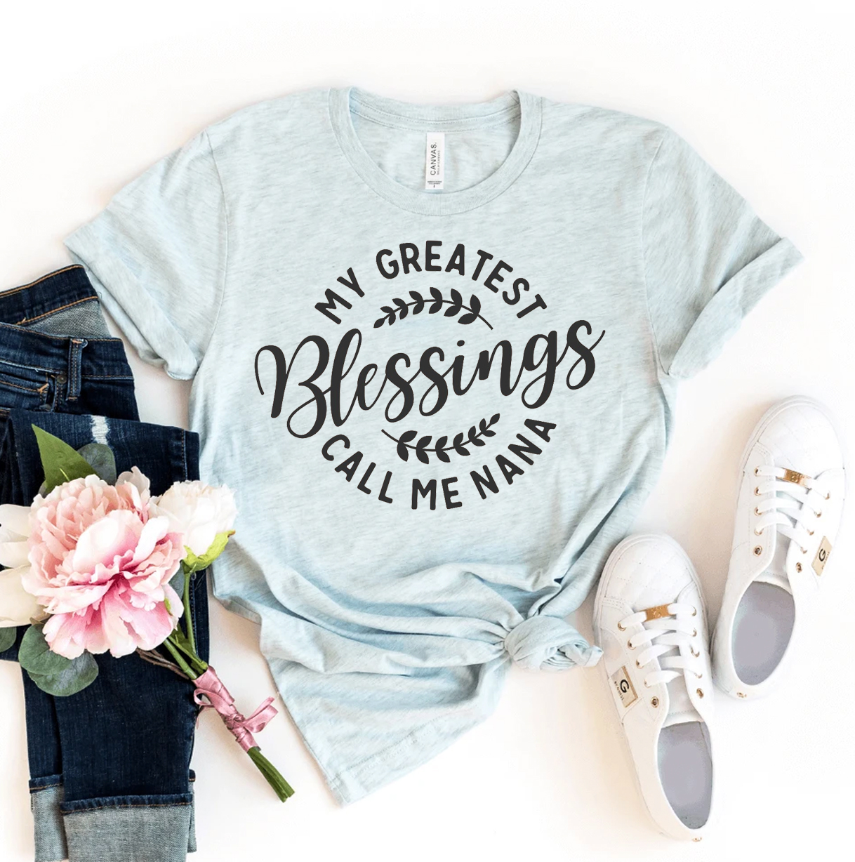 A soft, premium quality t-shirt featuring the phrase 'My Greatest Blessings Call Me Nana' in elegant print, perfect for grandmothers.