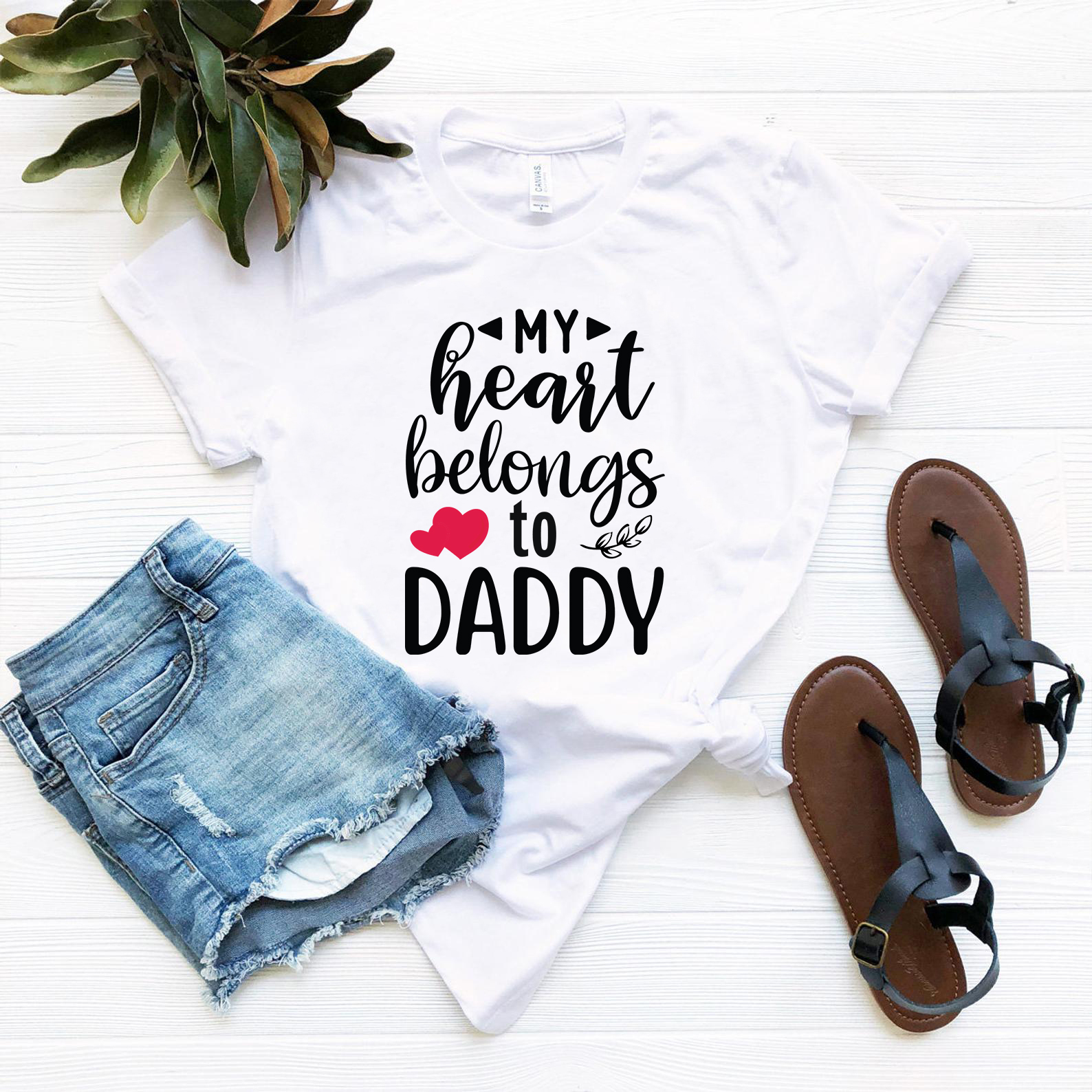 Unisex My Heart Belongs To Daddy Shirt in various colors, showcasing its soft fabric and stylish design.