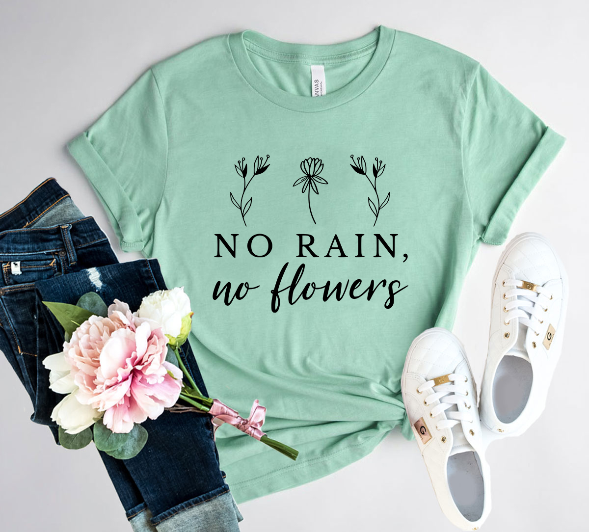A stylish unisex No Rain No Flowers Shirt made from soft ring spun cotton, available in multiple colors and sizes.