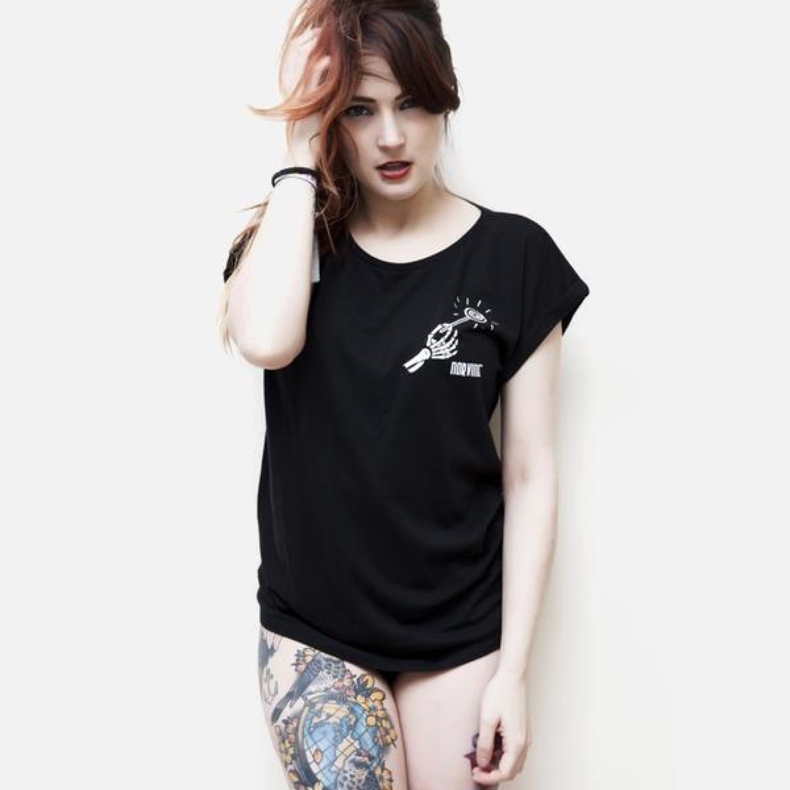 Norvine Candy Women's Rolled Sleeve Tunic Tee in black, featuring a crew neck and rolled sleeves, made from 100% combed cotton.