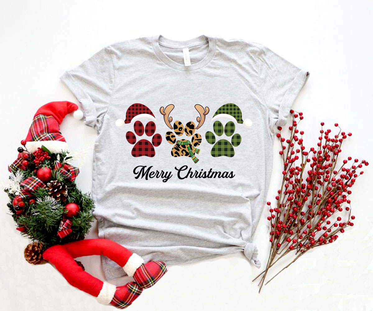 A festive Paw Merry Christmas Shirt featuring a playful design, crafted from soft ring spun cotton, available in multiple colors.