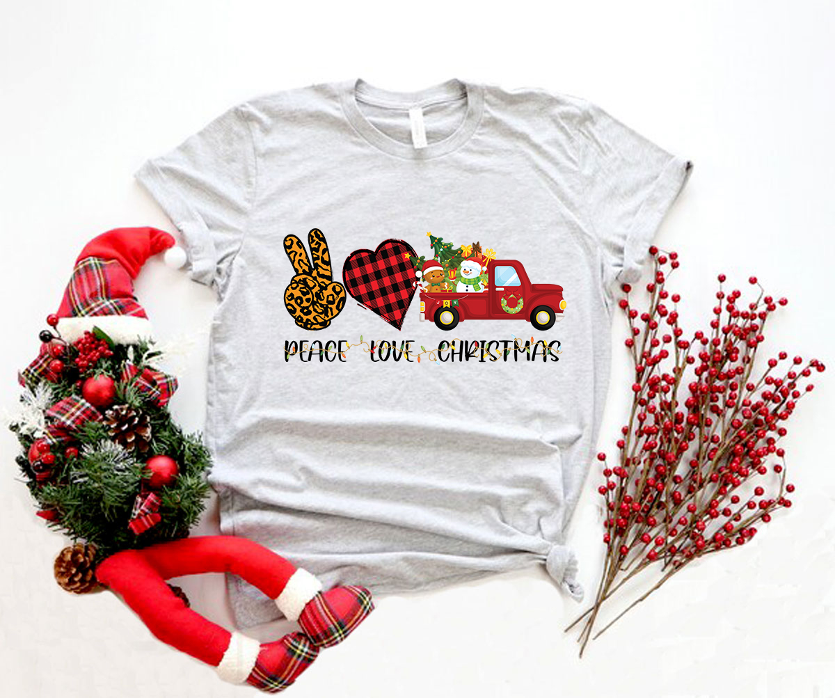 A unisex Peace Love Christmas Shirt in various colors, showcasing its soft fabric and festive design, perfect for holiday celebrations.
