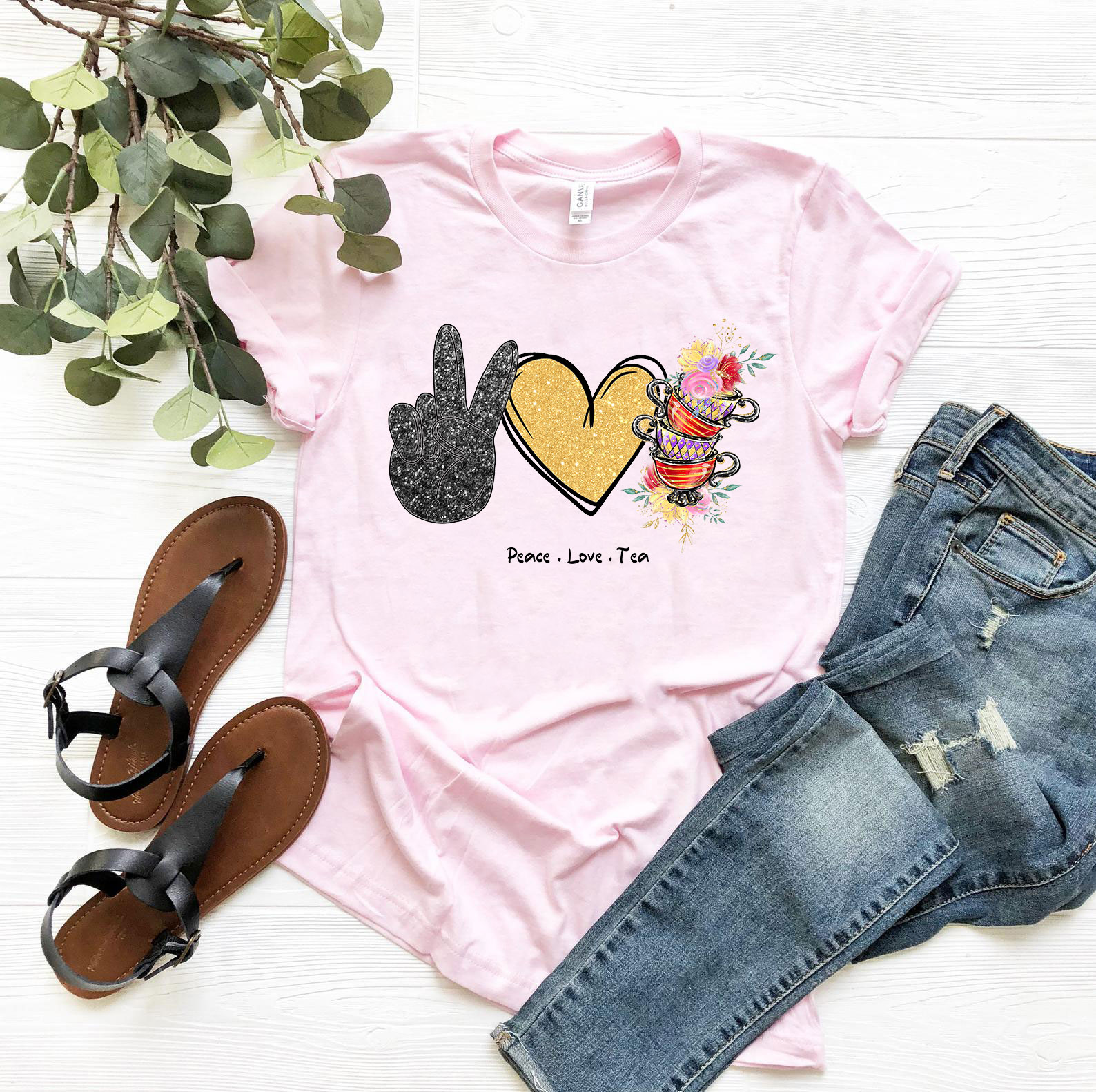 A comfortable unisex Peace Love Tea Shirt made from ring spun cotton, featuring a stylish design and available in various colors.