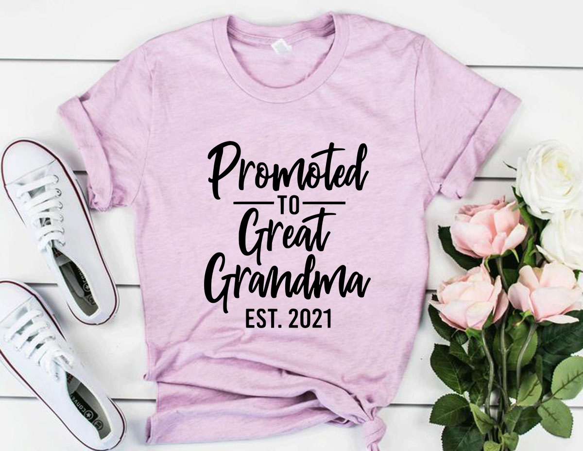 A soft unisex T-shirt with the text 'Promoted To Great Grandma' printed on it, available in various colors.