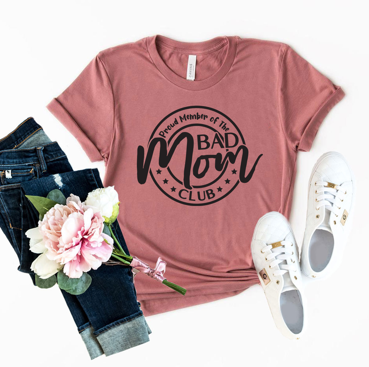 A unisex Proud Member Of The Bad Mom Shirt displayed in various colors, showcasing its soft fabric and stylish design.