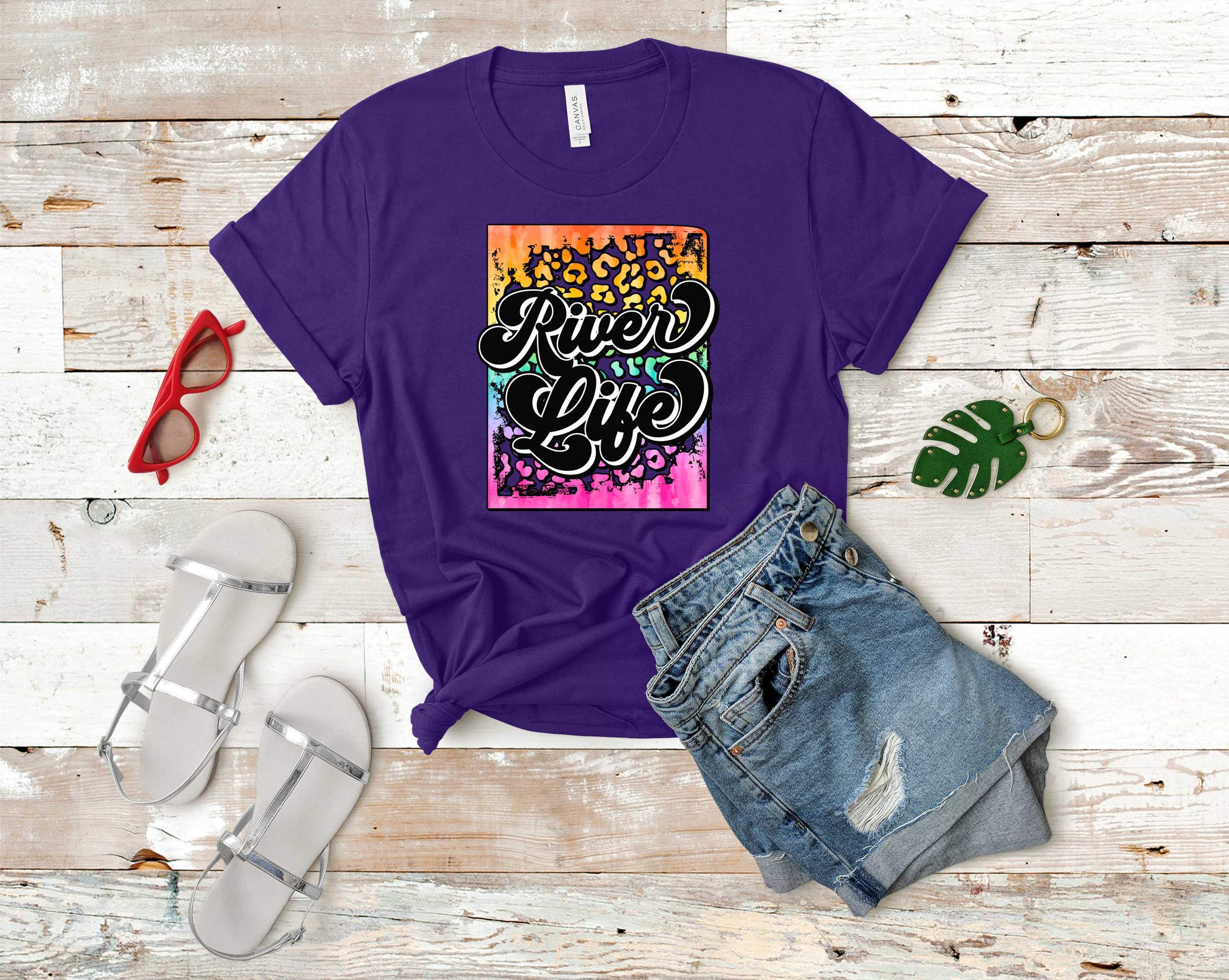 A vibrant unisex t-shirt featuring a colorful rainbow river graphic design, perfect for casual wear.