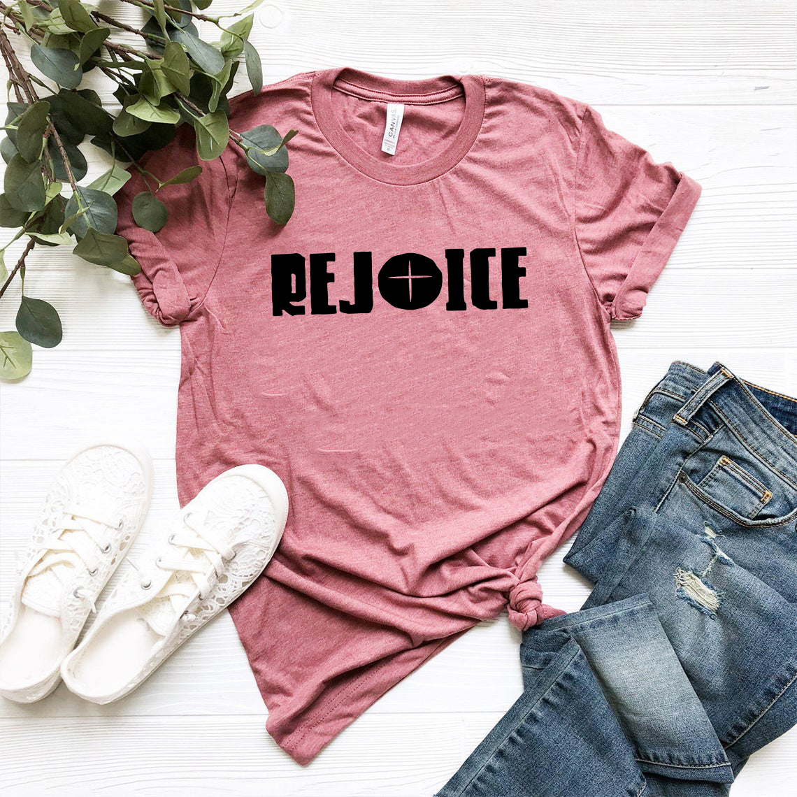 Rejoice Unisex T-shirt in various colors, showcasing its soft fabric and stylish design.