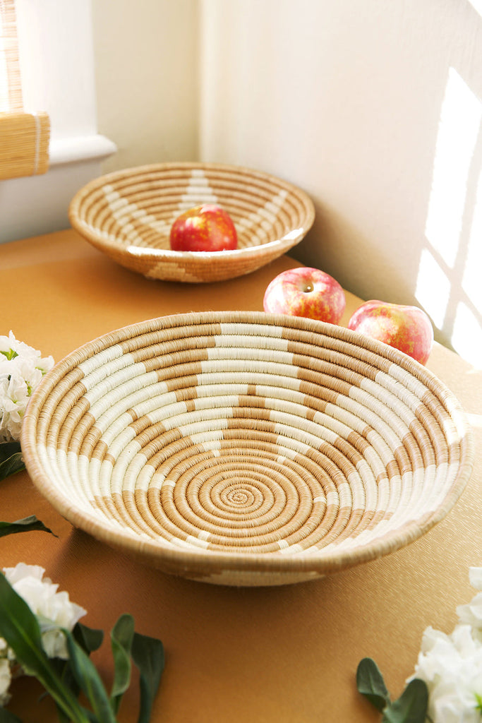 Handcrafted Rwanda inspired sisal basket, showcasing intricate weaving and natural fibers, perfect for storage or decoration.