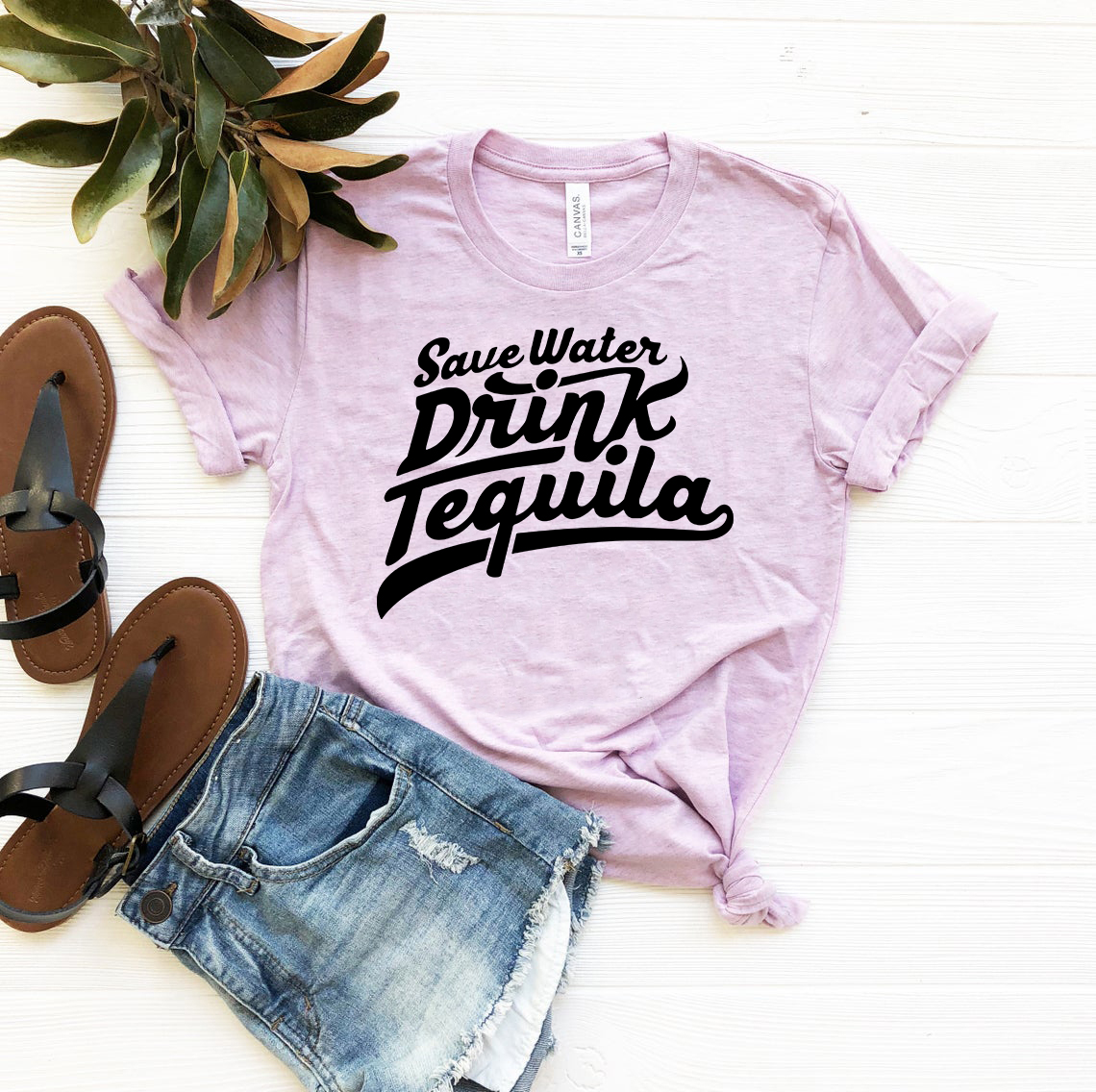 A stylish unisex Save Water Drink Tequila Shirt in various colors, made from soft ring spun cotton, featuring a humorous print.