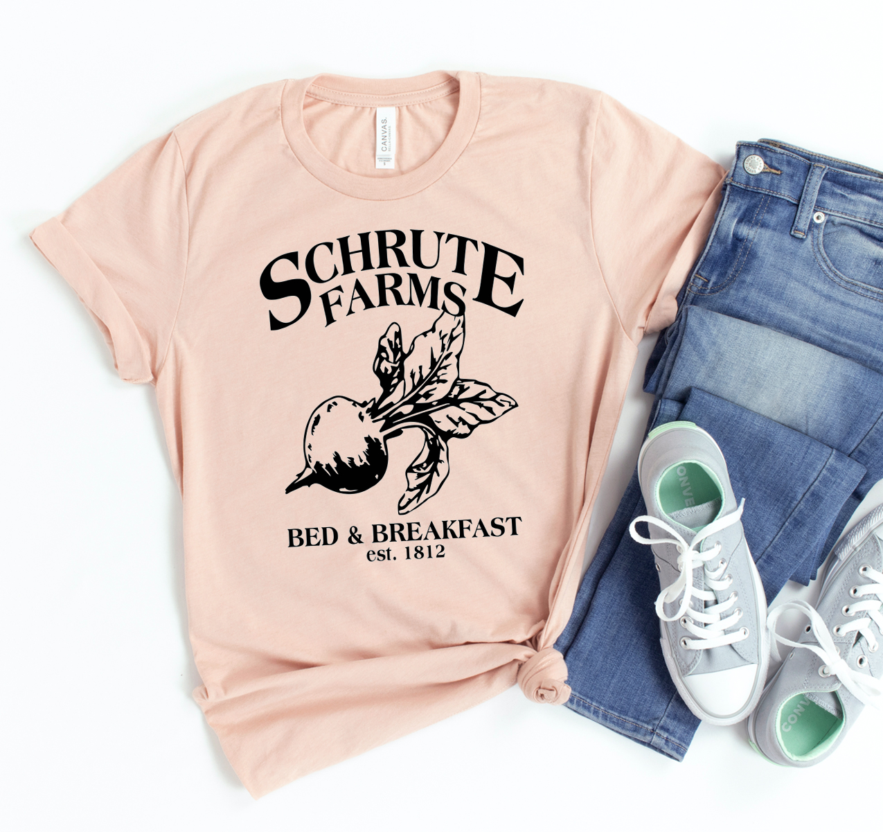 Schrute Farms T-shirt featuring a classic unisex design made from soft airlume cotton, available in various sizes.