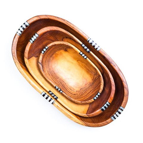 Set of 3 hand-carved oval wooden salad and fruit bowls with batik bone accents, showcasing unique craftsmanship and natural wood grain.