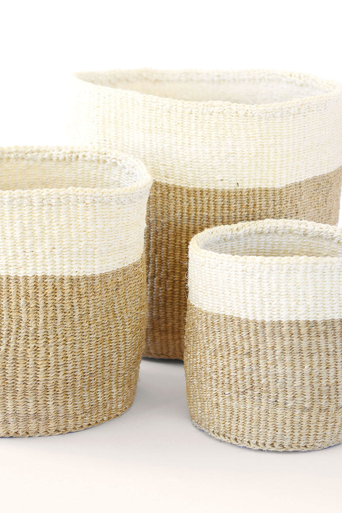 Set of three handwoven sisal baskets in various sizes, showcasing natural fibers and vibrant colors, perfect for planters or storage.