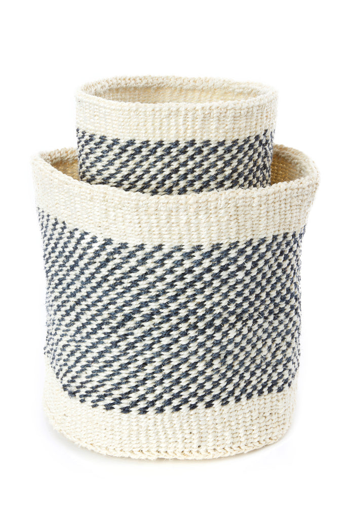 A set of two handwoven sisal fibre baskets in natural and vibrant colors, showcasing their nesting design and artisanal craftsmanship.