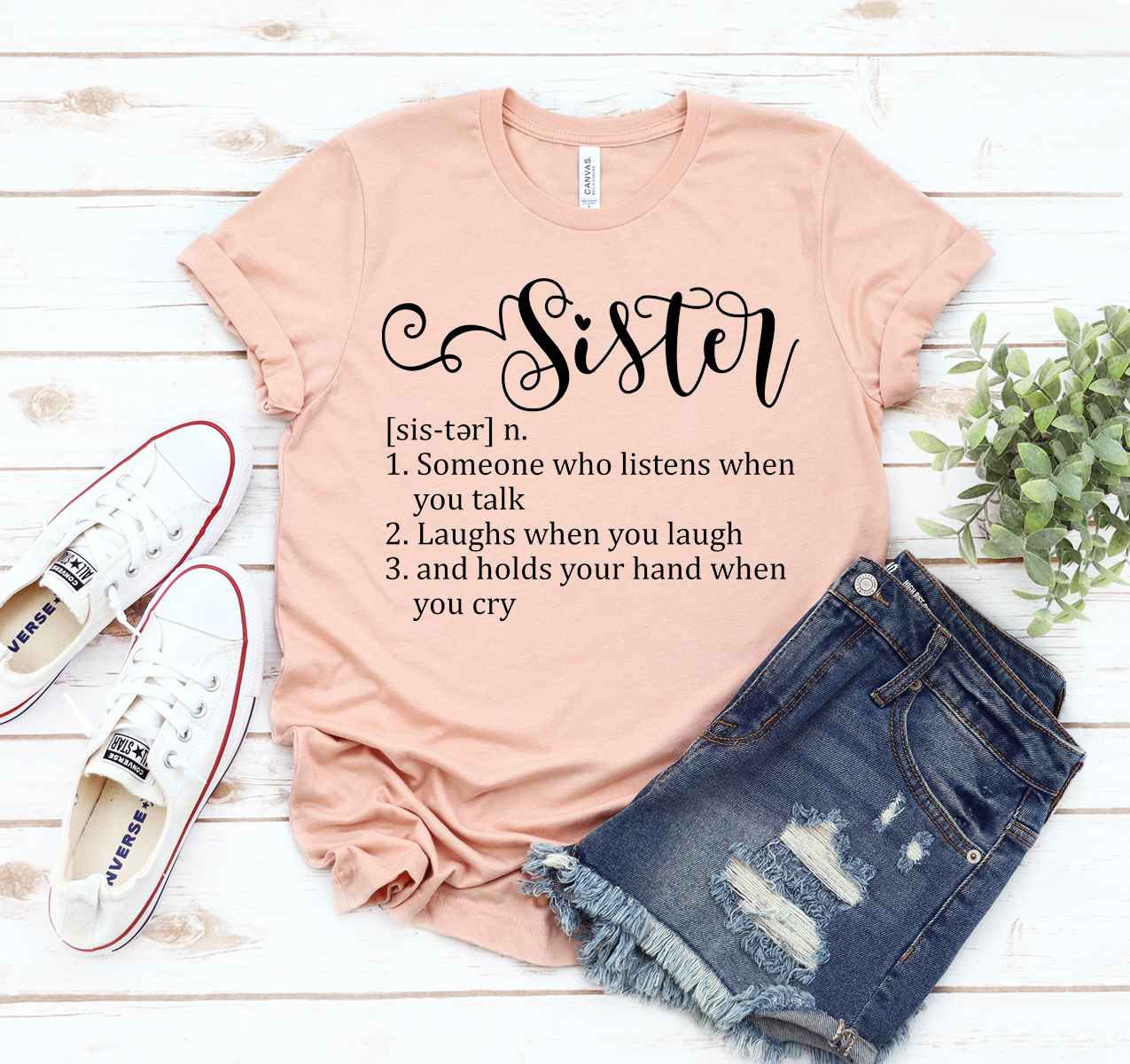 A stylish unisex Sister Definition T-shirt made from soft airlume cotton, showcasing its comfortable fit and available sizes.