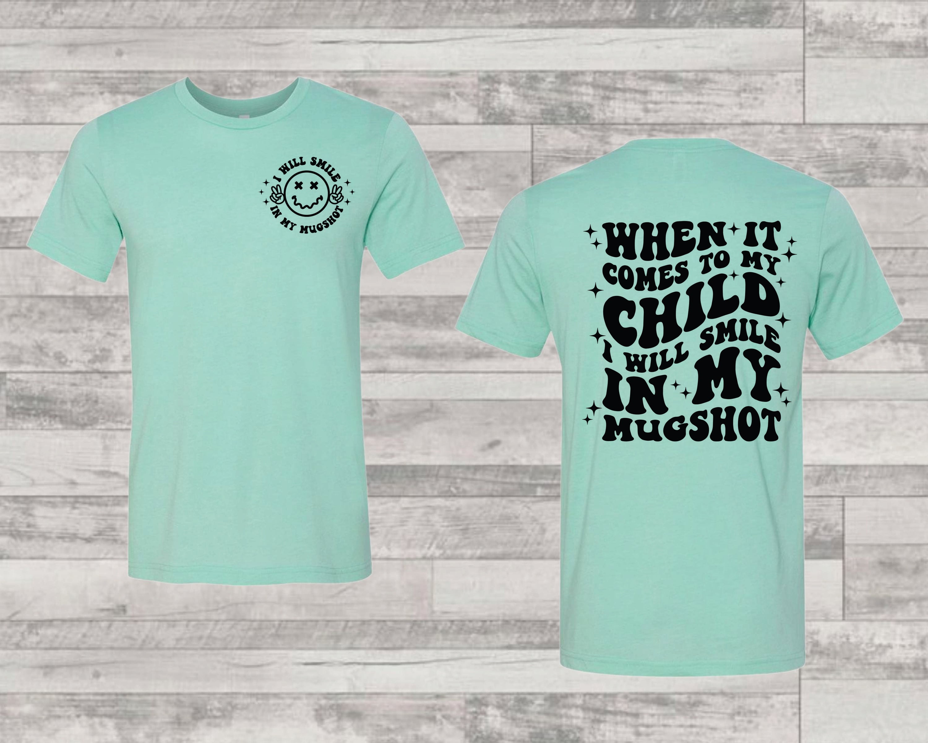 A unisex graphic tee featuring a playful design with the text 'Smile In My Mugshot' printed on the front, showcasing a casual and stylish look.