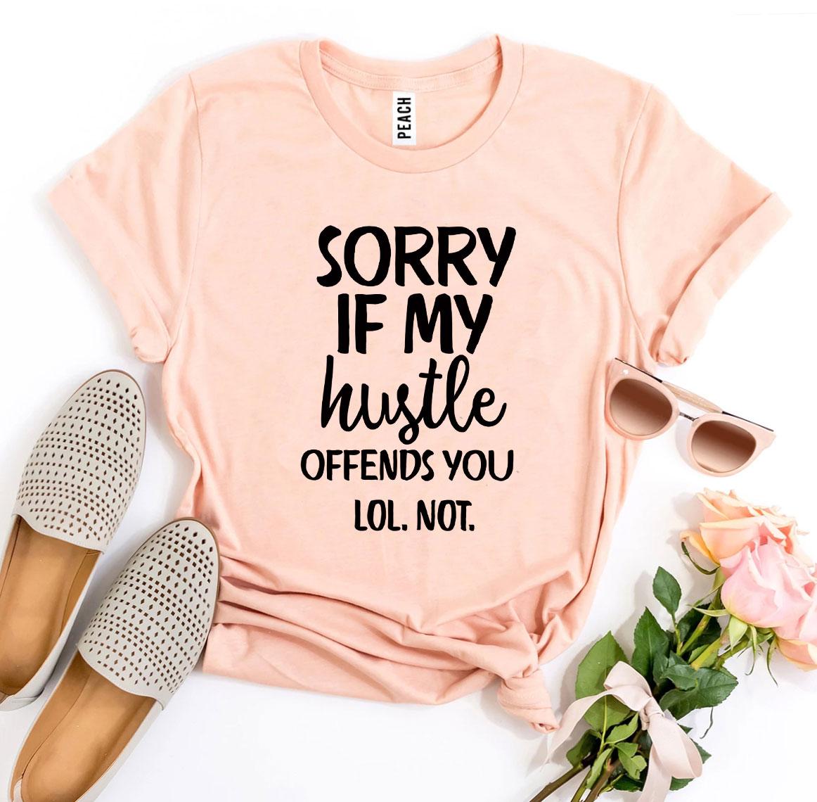 A stylish black t-shirt featuring the phrase 'Sorry If My Hustle Offends You' in bold white text, made from premium ring spun cotton.