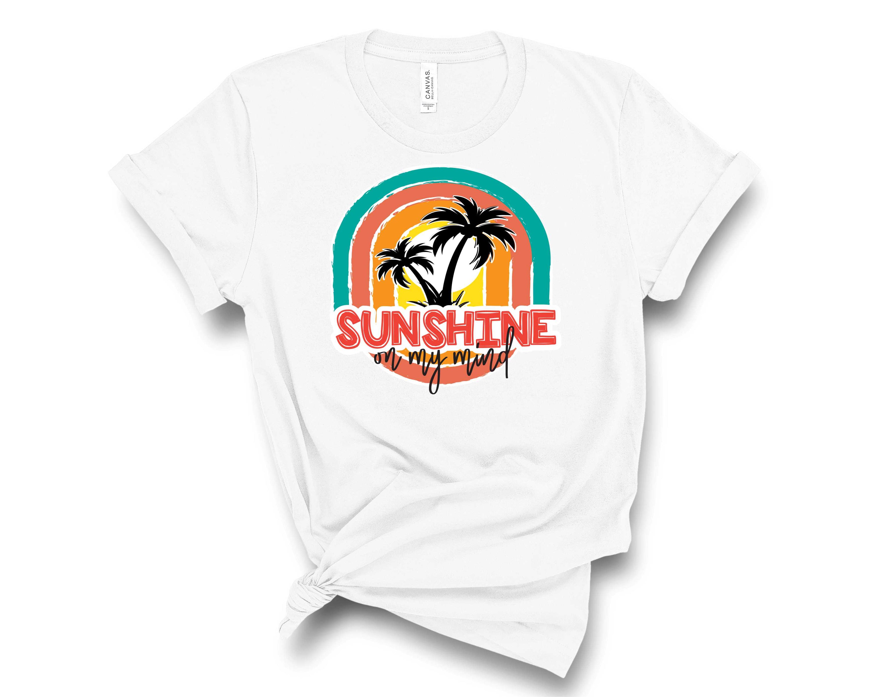 A vibrant unisex graphic tee featuring a sunny design with the phrase 'Sunshine on my Mind', perfect for casual wear.