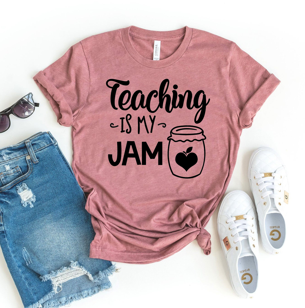 A stylish 'Teaching Is My Jam' T-shirt made from premium ring spun cotton, featuring a vibrant flex print design.