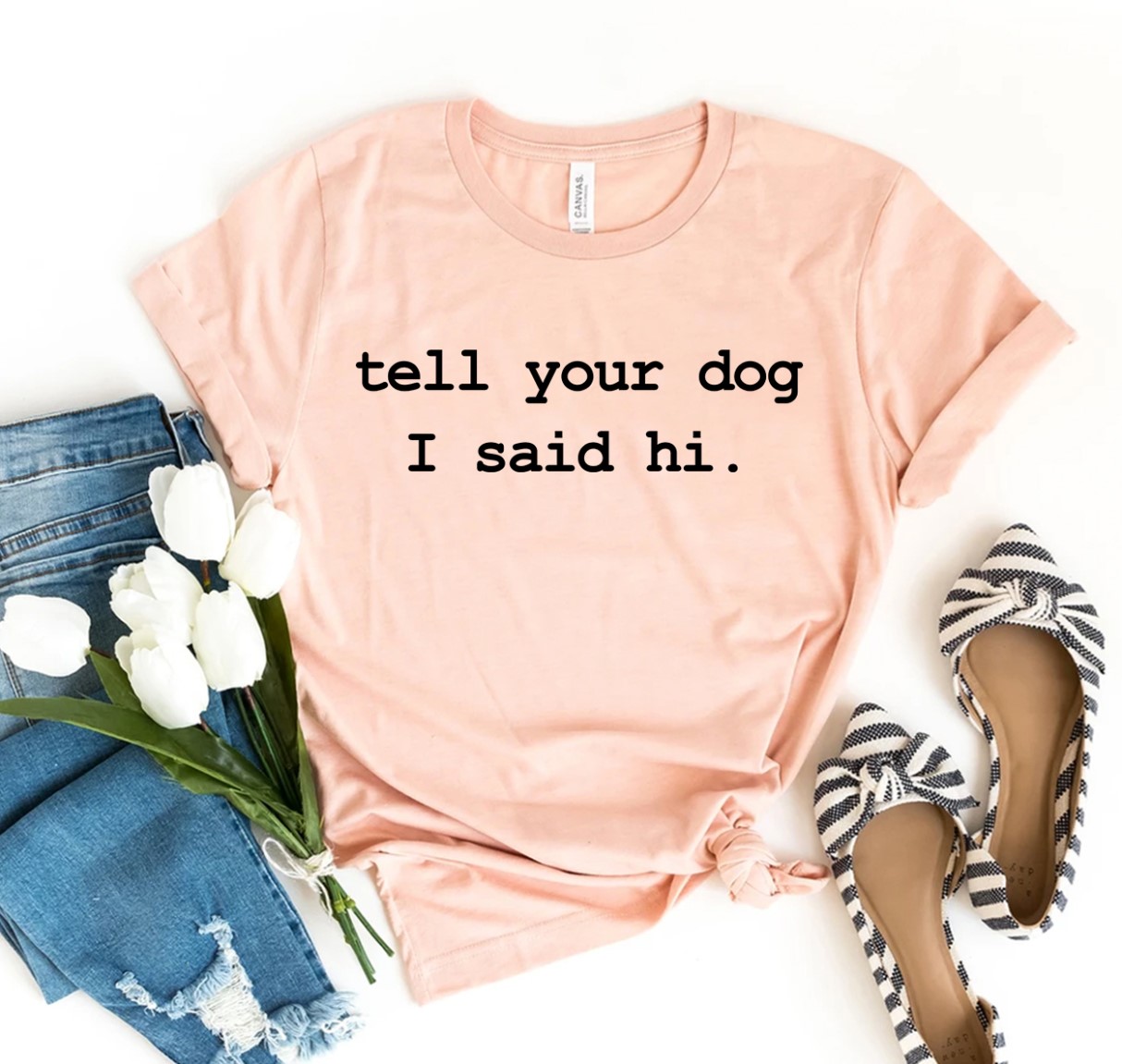 Tell Your Dog I Said Hi T-shirt in various sizes, showcasing a playful design on premium cotton fabric.