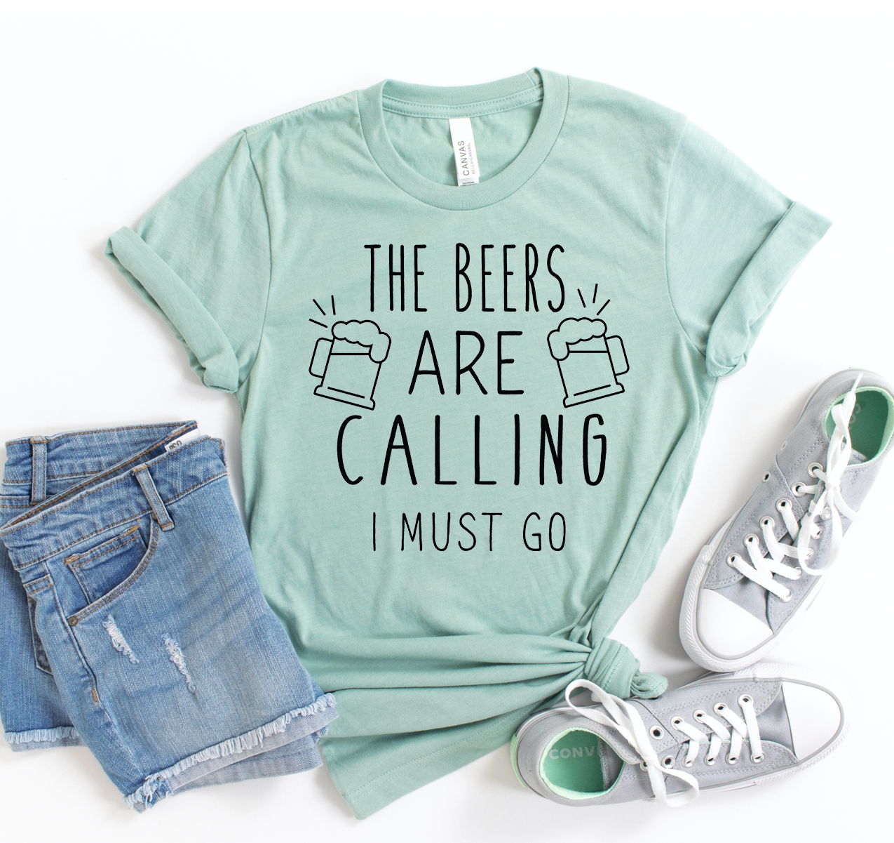 The Beers Are Calling I Must Go T-shirt in a classic unisex style, featuring a fun phrase, made from soft cotton fabric.
