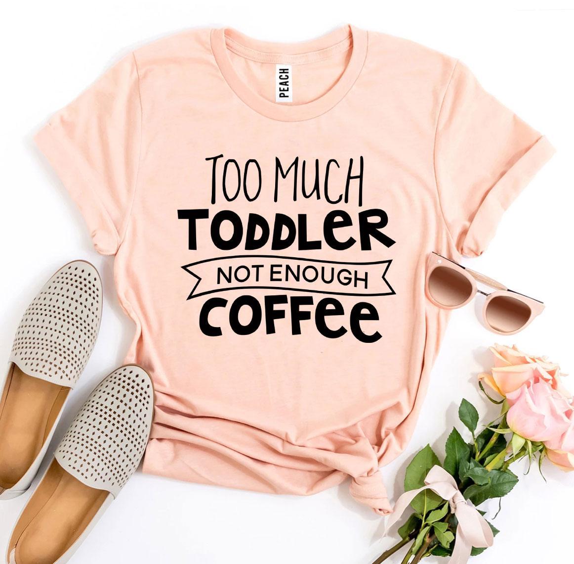 A stylish black t-shirt with the phrase 'Too Much Toddler Not Enough Coffee' printed in bold white letters, showcasing a fun design for parents.