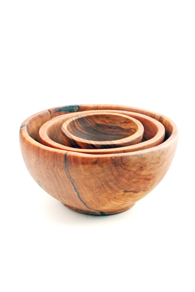Trio Olive Wood Condiment Bowls, hand-carved from solid olive wood, showcasing unique grain patterns and three different sizes.