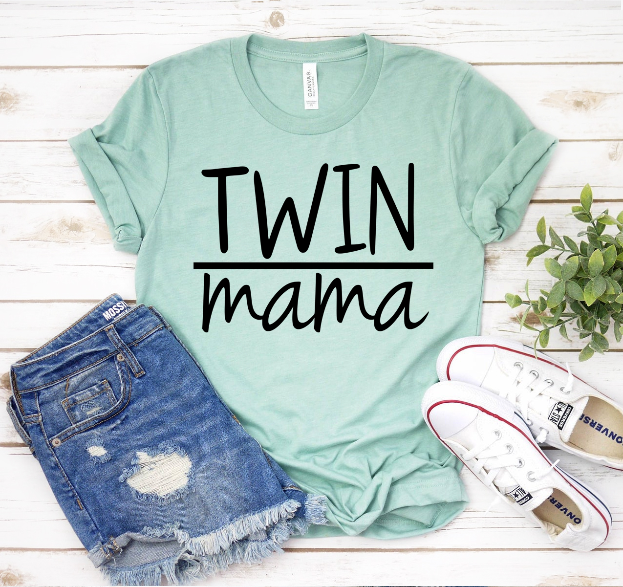 Twin Mama T-shirt in various sizes, showcasing its soft fabric and unisex design.