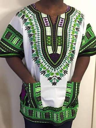 Unisex African Dashiki Wear shirt in white and green, showcasing vibrant patterns and 100% cotton fabric.