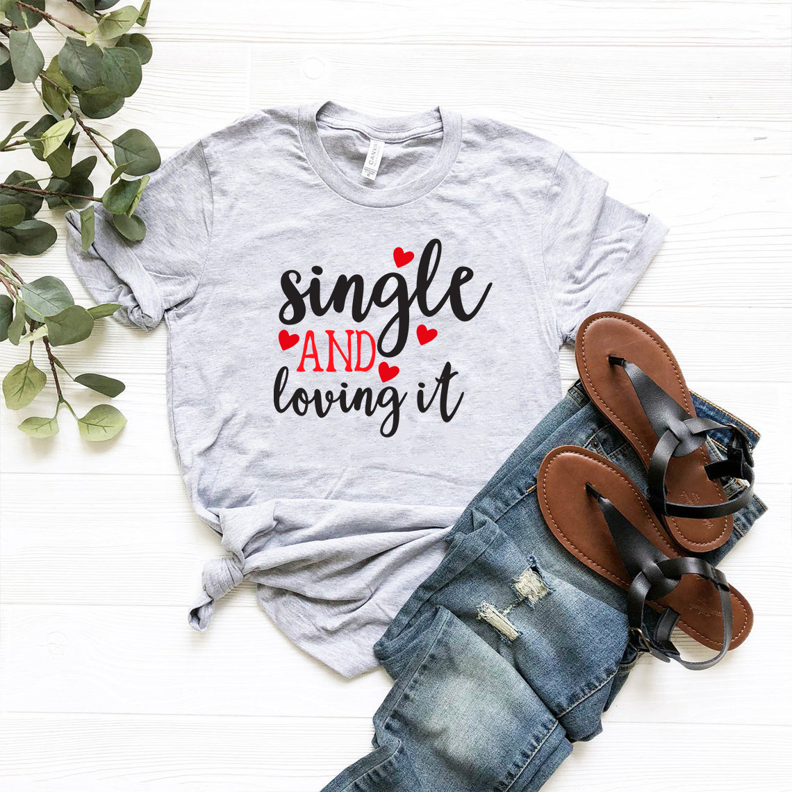 VAL0152 Single And Loving It Shirt in various colors, showcasing its soft fabric and stylish design.