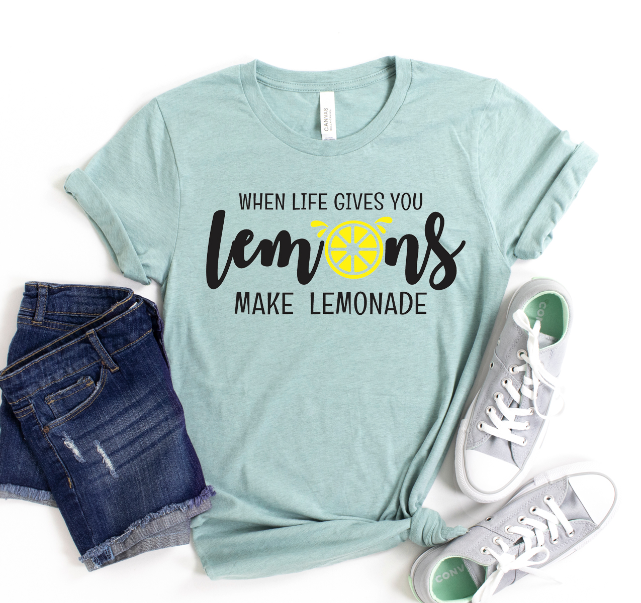 A unisex Bella Canvas T-shirt featuring the phrase 'When Life Gives You Lemons Make Lemonade' in a vibrant print.