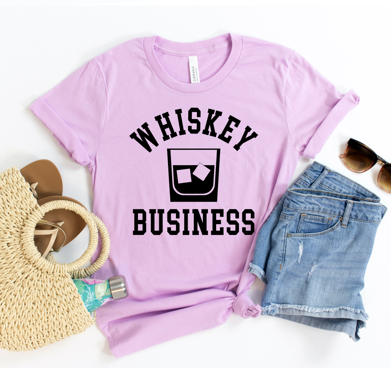 Whiskey Business T-shirt displayed on a hanger, showcasing its classic unisex design and soft fabric.